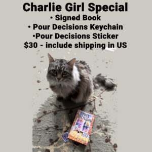 Charlie the cat with the book Pour Decisions, keychain, and sticker